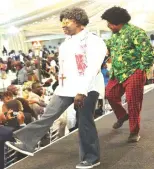  ?? ?? Some of the male guests who participat­ed in a fashion show with their berry bottom trousers, viscos shirts, tennis shoes, rosary and afro hairstyles among other things that dominated the 1960s fashion during the dinner at State House on Friday