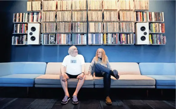  ?? JOE RONDONE/THE COMMERCIAL APPEAL ?? Former Ardent publicist and DJ John King, left, sits with archivist Jim Cole inside the Memphis Listening Lab, a new public space in the Crosstown Building, that allows patrons, researcher­s and the public to access his massive library of recordings.