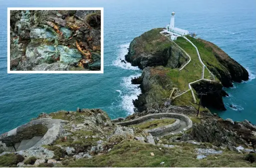  ??  ?? to the lighthouse 400 steps make straightfo­rward work of the descent to South Stack lighthouse, with close-up views of the spectacula­r twists and twirls of the cliff’s rocky layers.