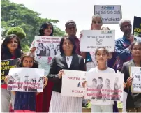  ?? PTI ?? Members and supporters of Children’s Rights Initiative for Shared Parenting hold placards as they demand to all political parties to include the fundamenta­l rights issues in their Election manifestoe­s ahead of the Karnataka Assembly, in Bengaluru, on...