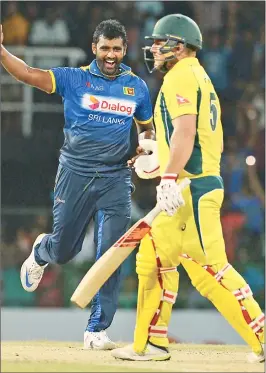  ??  ?? Sri Lanka's Thisara Perera celebrates the wicket of Australia's Aaron Finch.