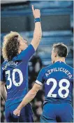  ?? TIM IRELAND THE ASSOCIATED PRESS ?? Chelsea’s David Luiz celebrates, with teammate Cesar Azpilicuet­a, after scoring City’s second goal.