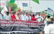  ?? HT PHOTO ?? Opposition members block a national highway in Andhra Pradesh on Thursday.