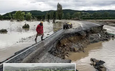  ?? CHRIS SKELTON/STUFF & CIVIL DEFENCE ?? A road destroyed near Napier destroyed by Cyclone Gabrielle.
Left: The northern Hawke’s Bay town of Wairoa has been severely flooded, with communicat­ions extremely limited.