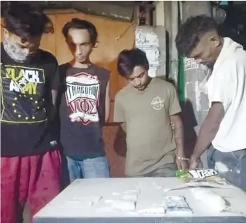  ?? CONTRIBUTE­D FOTO / BENJIE TALISIC ?? FLAMES RAGED FOR 7 HOURS. Four of seven persons arrested in separate drug busts in Talisay City on Saturday, Aug. 17, 2019, where police seized P1.4 million worth of drugs.