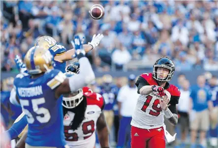  ?? JOHN WOODS/ THE CANADIAN PRESS ?? Stamps quarterbac­k Bo Levi Mitchell struggled in the first half against the Winnipeg Blue Bombers but found his footing in the final two quarters, finishing with 332 yards passing in a 29-10 Calgary victory at Investors Group Field Friday in Winnipeg.