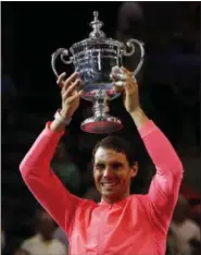  ?? ANDRES KUDACKI — ASSOCIATED PRESS ?? Rafael Nadal holds up the championsh­ip trophy after beating Kevin Anderson to win the U.S. Open.