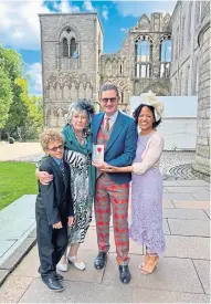  ?? ?? Gus Noble is head of the Chicago Scots charity in Illinois and, above, after receiving his OBE in Edinburgh with son Bobby, mum Joan and wife Aisha.