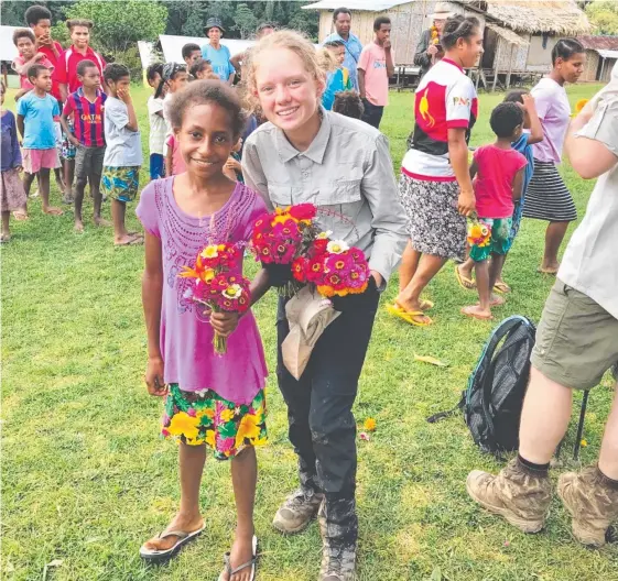  ??  ?? Coomera Anglican College student Lilly Caulfield, 14, made plenty of friends as she trekked the Kokoda Track and other 39th Battalion routes in PNG over the holidays.