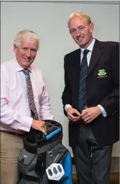  ??  ?? Terence Murray, a winner in the President’s Prize Competitio­n at Blainroe Golf Club, receives his prize from Club President Terence Ryan.