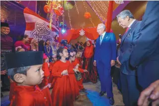  ?? ASHRAF SHAMSUL/ THE SUN ?? ... Prime Minister, Datuk Seri Najib Abdul Razak and his deputy Datuk Seri Ahmad Zahid Hamidi at the Prime Minister’s Department Aidilfitri celebratio­n at the Putrajaya Internatio­nal Convention Centre, Putrajaya yesterday.