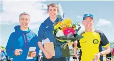  ?? Photograph: John McFadyen. ?? Men's half marathon winner Kieran Cooper, centre, with his dad Richard, who placed second, left, and third placed Neil Nairn, right.