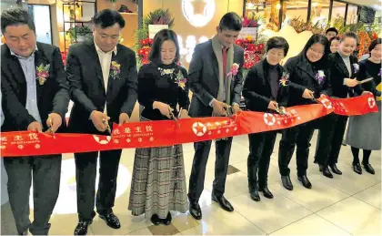  ?? Photo: Ministry of Industry, Trade and Tourism. ?? Permanent Secretary for Industry, Trade and Tourism Shaheen Ali (fourth left) was chief guest at the opening of the “Jiaozi in the spotlight”, a dumpling Restaurant, in the Paris Spring shopping mall in Shanghai.