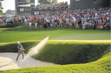  ?? JOHN WOIKE/HARTFORD COURANT VIA AP ?? Jordan Spieth holed his bunker shot on the 18th green for a birdie and win the Travelers Championsh­ip tournament.