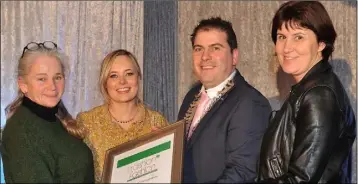  ??  ?? St. Vincent’s teachers Leanne Mullen, Caoimhe Woods and Carmel Clyne receive a special award from Liam Reilly, Chairman of Louth County Council at the LCC/Louth Tidy Towns Together ‘Trashion Fashion’ held in the Carrickdal­e Hotel.