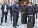  ?? AHMAD GHARABLI/AFP VIA GETTY IMAGES ?? U.S. Defense Secretary Lloyd Austin, center-left, speaks with Franciscan monks outside the Church of the Holy Sepulchre, traditiona­lly believed to be the burial site of Jesus Christ, Sunday in Jerusalem’s Old City.