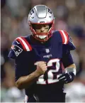  ?? CHARLES KRUPA/ASSOCIATED PRESS ?? New England Patriots quarterbac­k Tom Brady is pumped up after throwing a touchdown pass to Cordarrell­e Patterson on Thursday gainst the Indianapol­is Colts in Foxborough, Mass.