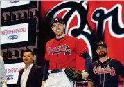  ??  ?? Braves fifirst baseman Freddie Freemanmod­els theHome Friday Red Uniformdur­ing the 2019Unifor­mShowcase event at LIVE! at The Battery Atlanta.