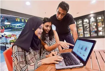  ??  ?? Jumble Station’s e-commerce manager Farah Nisha Mohd Hafiz, PWP social coordinato­r Jaya B and Maxis head of business developmen­t Senthil Balan Danapalan have worked hard to set up Jumble Station’s e-commerce website. — RAJA FAISAL HISHAN/ The Star From...