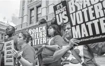  ?? Tamir Kalifa / Getty Images ?? Demonstrat­ors rally against voter restrictio­ns on the first day of the special session. If discrimina­tory voting practices were upheld in Arizona, they could be upheld in Texas, too.