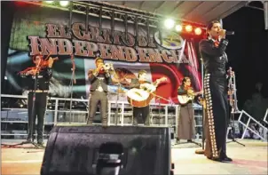  ??  ?? Mariachi Acero Del Valle performs on stage before a crowd during the El Centro El Grito event held at Stark Field on Sept. 20, 2014 in El Centro. SERGIO BASTIDAS FILE PHOTO