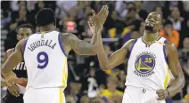  ?? BEN MARGOT/ASSOCIATED PRESS ?? The Warriors’ Kevin Durant, right, is congratula­ted by Andre Iguodala after scoring against Portland during the first half of their preseason game Friday in Oakland.