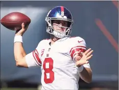  ?? Kamil Krzaczynsk­i / Associated Press ?? New York Giants quarterbac­k Daniel Jones looks to pass the ball against the Chicago Bears during the first half on Sunday.