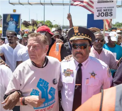  ?? ASHLEE REZIN/SUN-TIMES ?? Police Supt. Eddie Johnson joined the Rev. Michael Pfleger’s anti-violence march on the Dan Ryan last month.