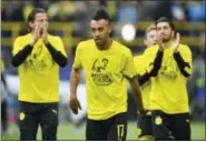  ?? MARTIN MEISSNER — THE ASSOCIATED PRESS ?? Dortmund’s Pierre-Emerick Aubameyang wears a t-shirt ‘A lot of strength — we are with you” for his teammate Marc Bartra who was injured after an explosion the day before prior to the Champions League quarterfin­al first leg soccer match between Borussia...