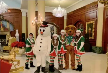  ?? Patricia Sheridan/Post-Gazette ?? Winter Wonderland characters greet guests in the lobby of The Chateau.