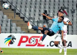  ?? ?? Showing the level of the Rich Boyz’ commitment, this spectacula­r effort by Nkululeko Miya beats Andali Jali to the ball