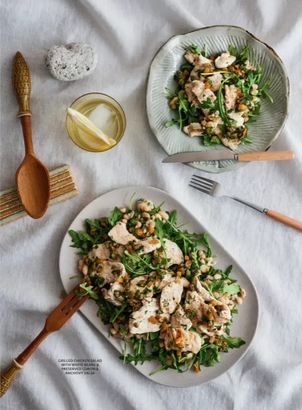  ??  ?? GRILLED CHICKEN SALAD WITH WHITE BEANS & PRESERVED LEMON & ANCHOVY SALSA