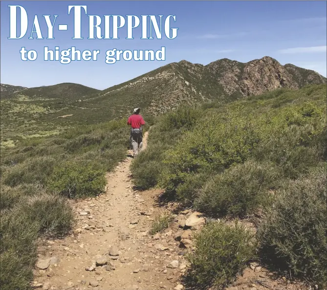  ?? LOANED PHOTOS ?? THE AUTHOR HEADS ALONG the Pacific Crest Trail toward Garnet Peak.