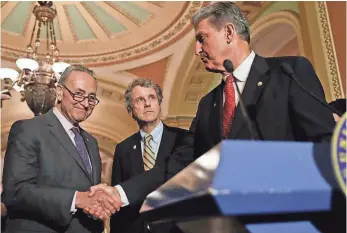  ?? PABLO MARTINEZ MONSIVAIS, AP ?? Senate Minority Leader Charles Schumer, left, Sen. Sherrod Brown, center, and Sen. Joe Manchin may borrow an argument from Democrats who fought tax cuts 35 years ago.