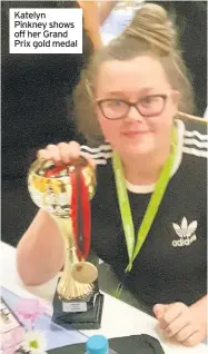  ??  ?? Katelyn Pinkney shows off her Grand Prix gold medal