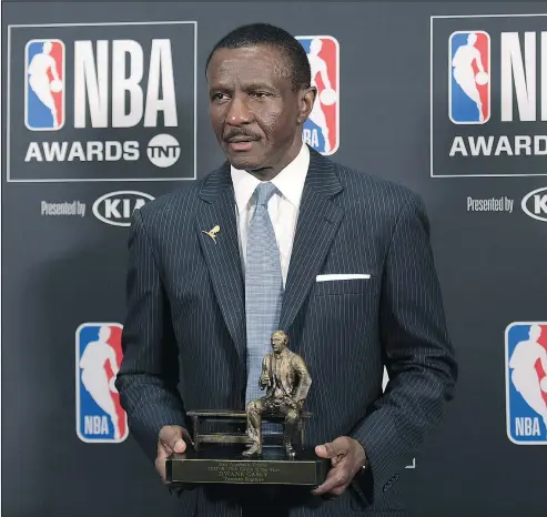  ?? — THE ASSOCIATED PRESS ?? Dwane Casey, current head coach of the Detroit Pistons, poses in the press room with the Coach of the Year Award for his work with the Raptors at the NBA Awards in Santa Monica, Calif., last night.