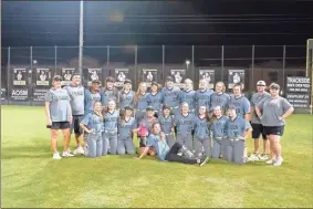  ?? Tim Godbee ?? The Calhoun softball team players and coaches are all smiiles after sweeping Decatur and Veterans High School in the past two weeks in the 5A state playoffs. The team will begin play Thursday afternoon in the Elite Eight in Columbus.