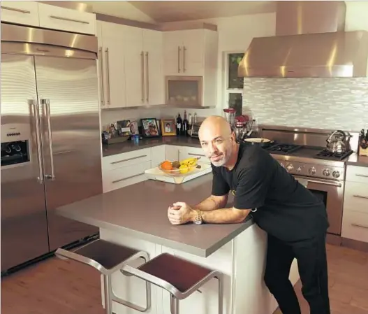  ?? Rick Loomis Los Angeles Times ?? JO KOY says people migrate to his kitchen, which includes a Thermador stove. “There’s this good energy,” he says.