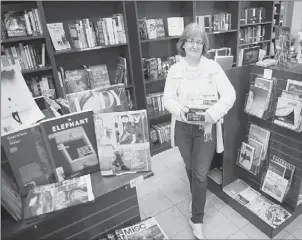  ?? Julia Rendleman/Post-Gazette ?? Tracy Thomas opened the Muse Stand, an independen­t bookstore, in May on Liberty Avenue in Bloomfield.