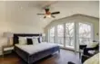  ??  ?? The third-level master-bedroom features a curved, vaulted ceiling.