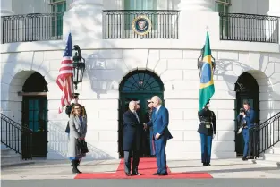  ?? SUSAN WALSH/AP ?? President Joe Biden greets Brazilian President Luiz Inacio Lula da Silva and his wife, Rosangela da Silva, at the White House on Feb. 10. Last month, supporters of Lula’s election rival stormed the Brazilian capital.