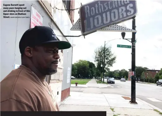  ?? MARK BROWN/SUN-TIMES ?? Eugene Burnett spent many years hanging out and drinking in front of this liquor store on Madison Street.