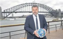  ?? AFP ?? Australia coach Ange Postecoglo­u poses near the Sydney Harbour Bridge.