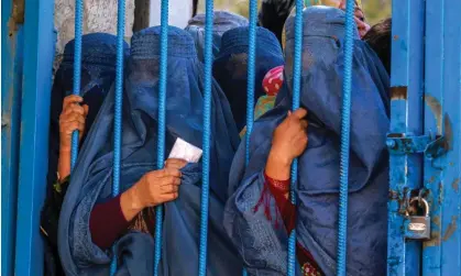  ?? Photograph: EPA ?? Afghan women wait to receive food aid in Kabul. Two-thirds of Afghanista­n’s population are estimated to be in need of humanitari­an assistance.