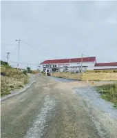  ?? ?? From left: Signal Hill in St John’s, where the first wireless signal was sent; the pub in Port Rexton; a signed copy of The Shipping News at one of the Newfoundla­nd cottages Kelly Dennett stayed in.