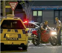  ?? PHOTO: ALDEN WILLIAMS/STUFF ?? Police inspect the Triumph Daytona on Worcester St, Central Christchur­ch.
