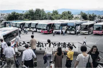  ?? PHOTO: GETTY IMAGES ?? Popular spot . . . Tourists walk back to a line of waiting buses after visiting the Kiyomizu Temple in Kyoto.