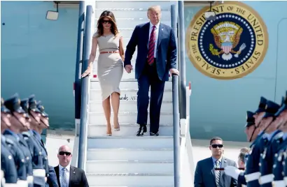  ?? AFP ?? US President Donald Trump and US first lady Melania Trump disembark Air Force one at Stansted Airport, north of london, on Thursday as he begins his first visit to the UK as US president. —