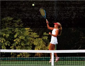  ?? MIKE BUSH/NEWS-SENTINEL ?? Lodi's Mary Barnes comes off the ground while getting ready to hit the tennis ball during her SacJoaquin Section Division II girls tennis team playoff match against Del Oro on Thursday.