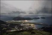  ?? WALLY SANTANA — THE ASSOCIATED PRESS FILE ?? A view from the 220-meter (670 feet) summit of Mt. Bi looks down on the airport’s single runway jutting out into the sea on Beigan in the Matsu island group, off northern Taiwan, on Aug. 22, 2012.